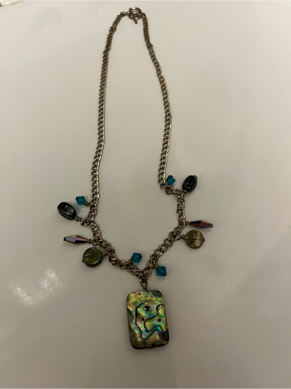 Iridescent Abalone Pendant Necklace with Teal Accents